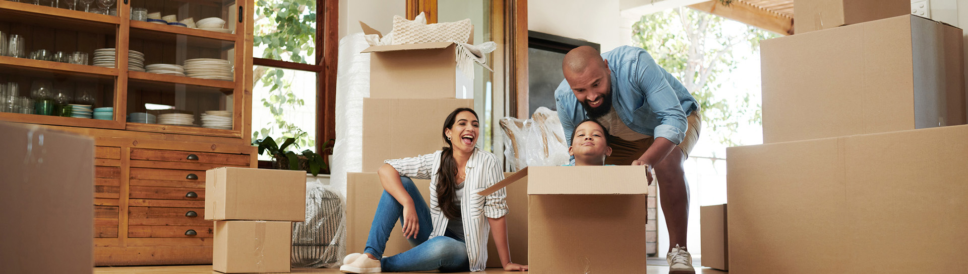 Family of three moving into new home.