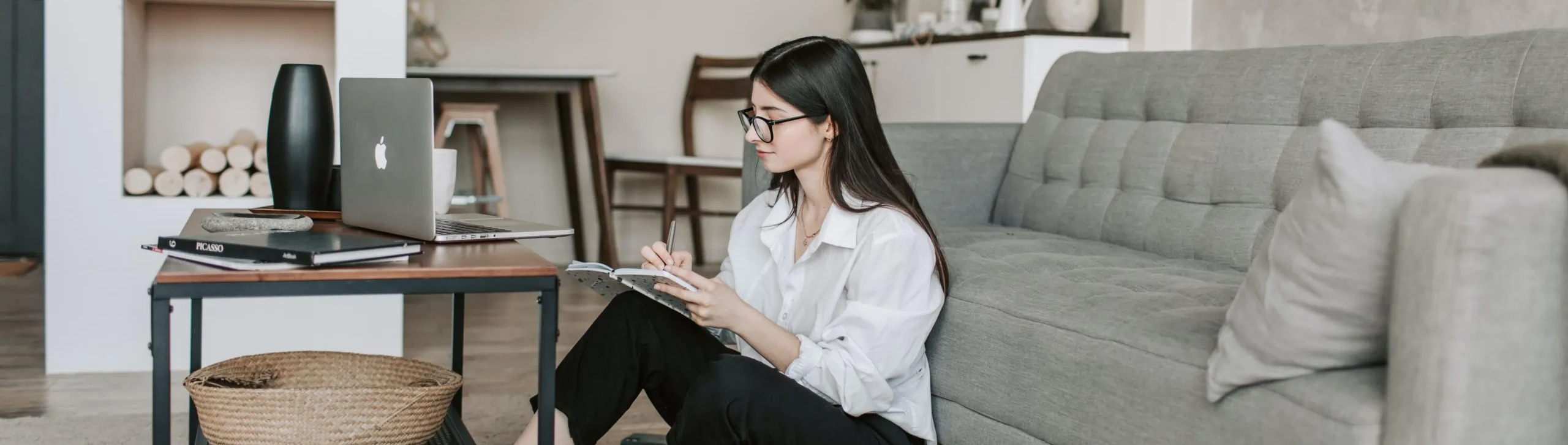 Young female taking notes.